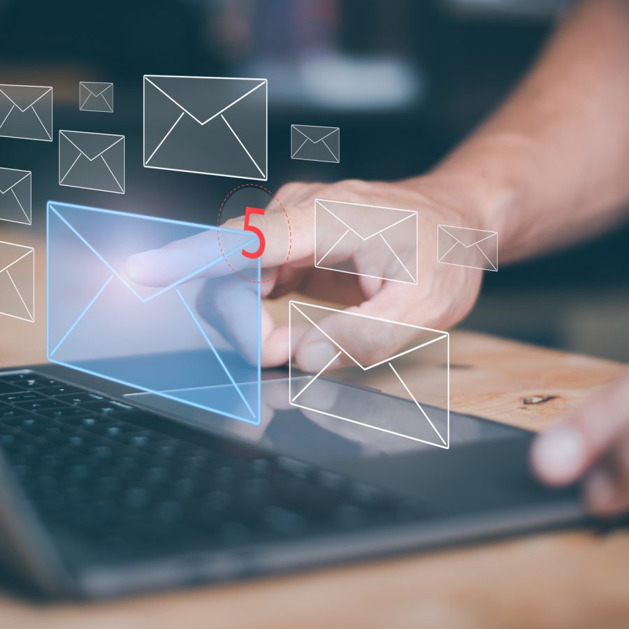 Businessman using laptop to open e-mail via virtual screen, Internet messaging concept, social media marketing, communicating with modern technology, online mail.
